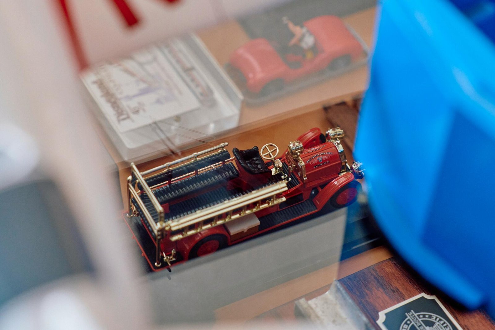 An early, open-aired model fire engine. 