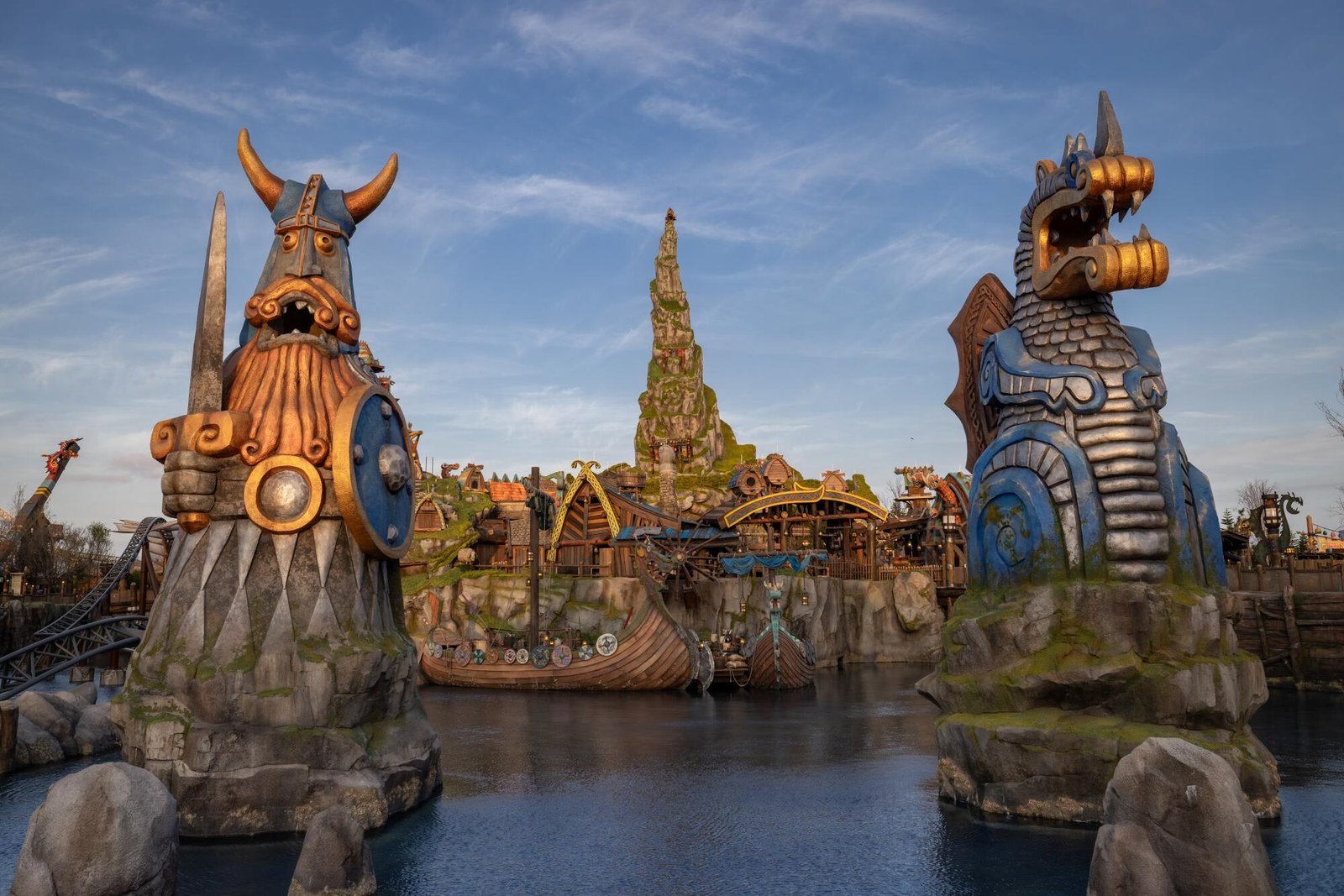 A sculpture of a Viking and a dragon in water.