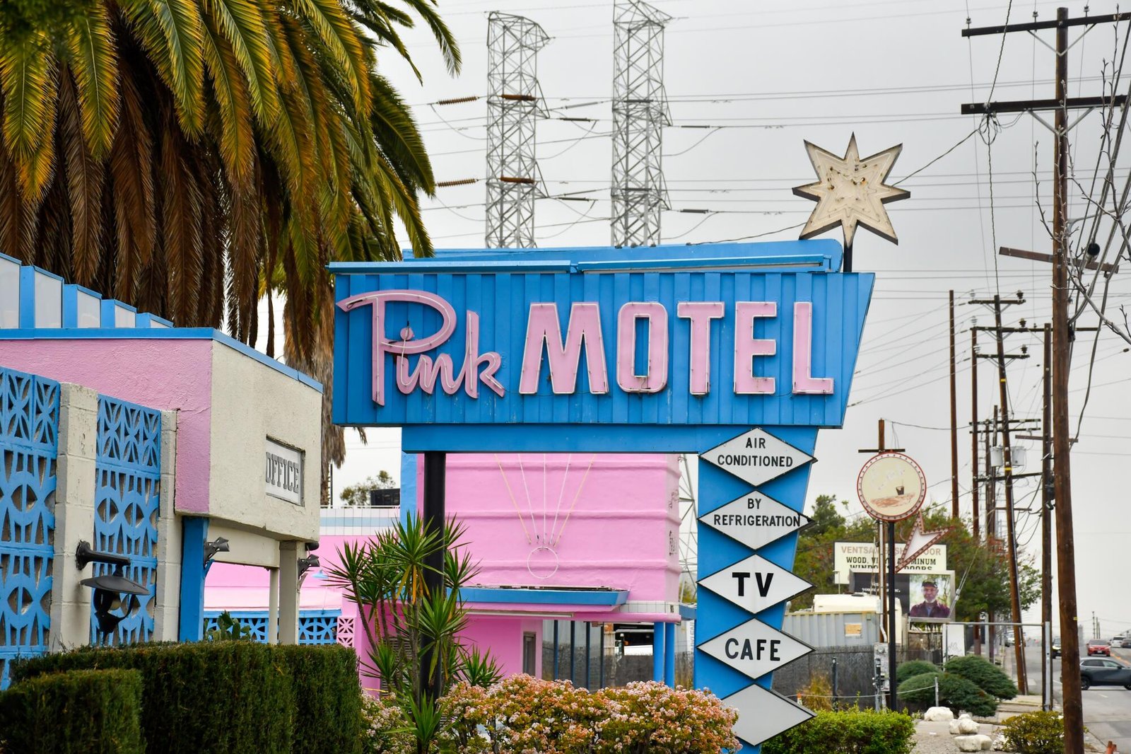 The Pink Motel's pink and blue exterior and sign