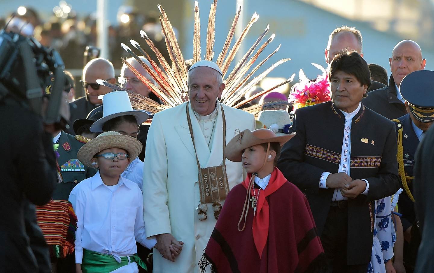 Pope Francis greets Bolivian native children next to Bolivian President Evo Morales on July 8, 2015.
