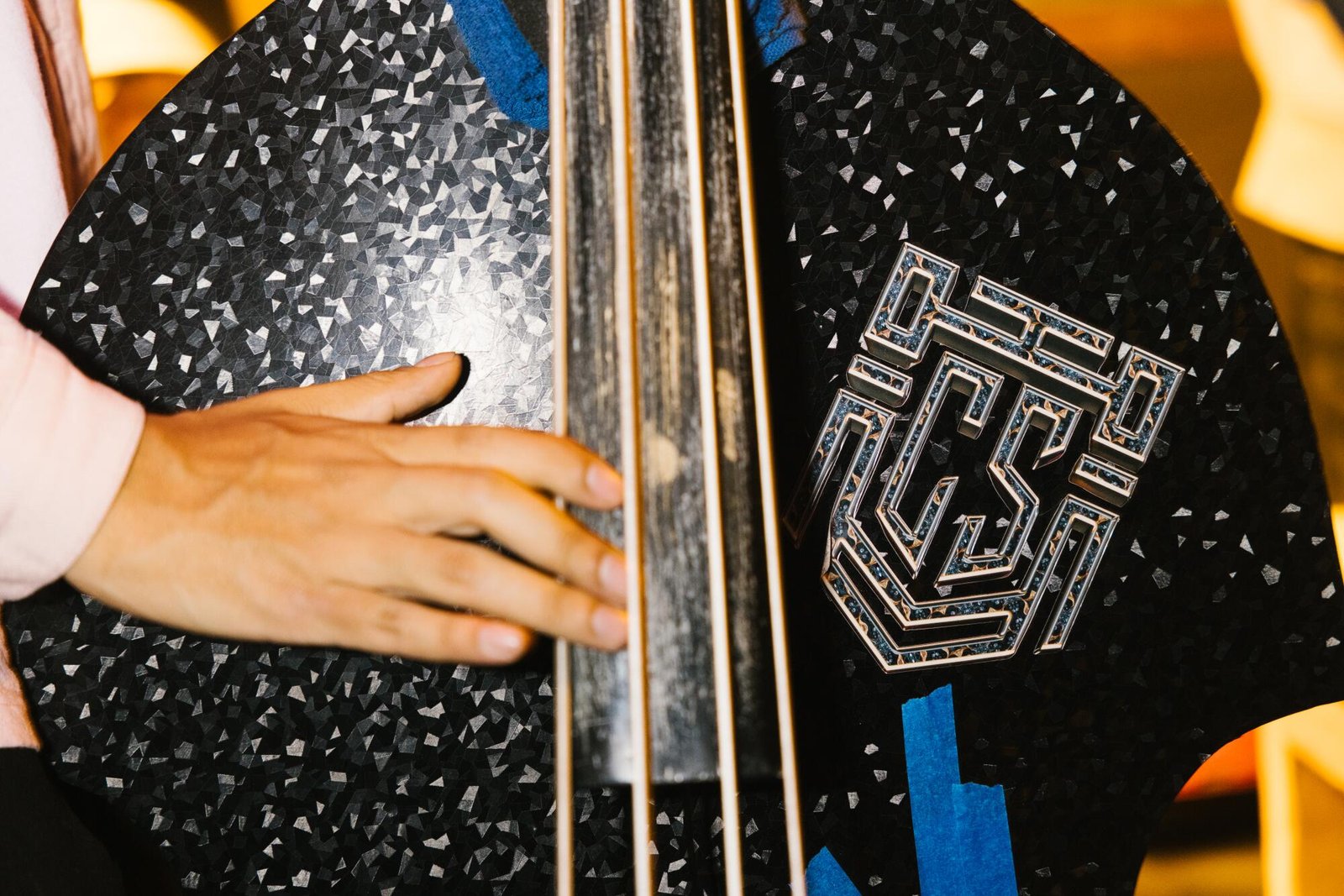 A musician plays the double bass at Los Guitarrazos