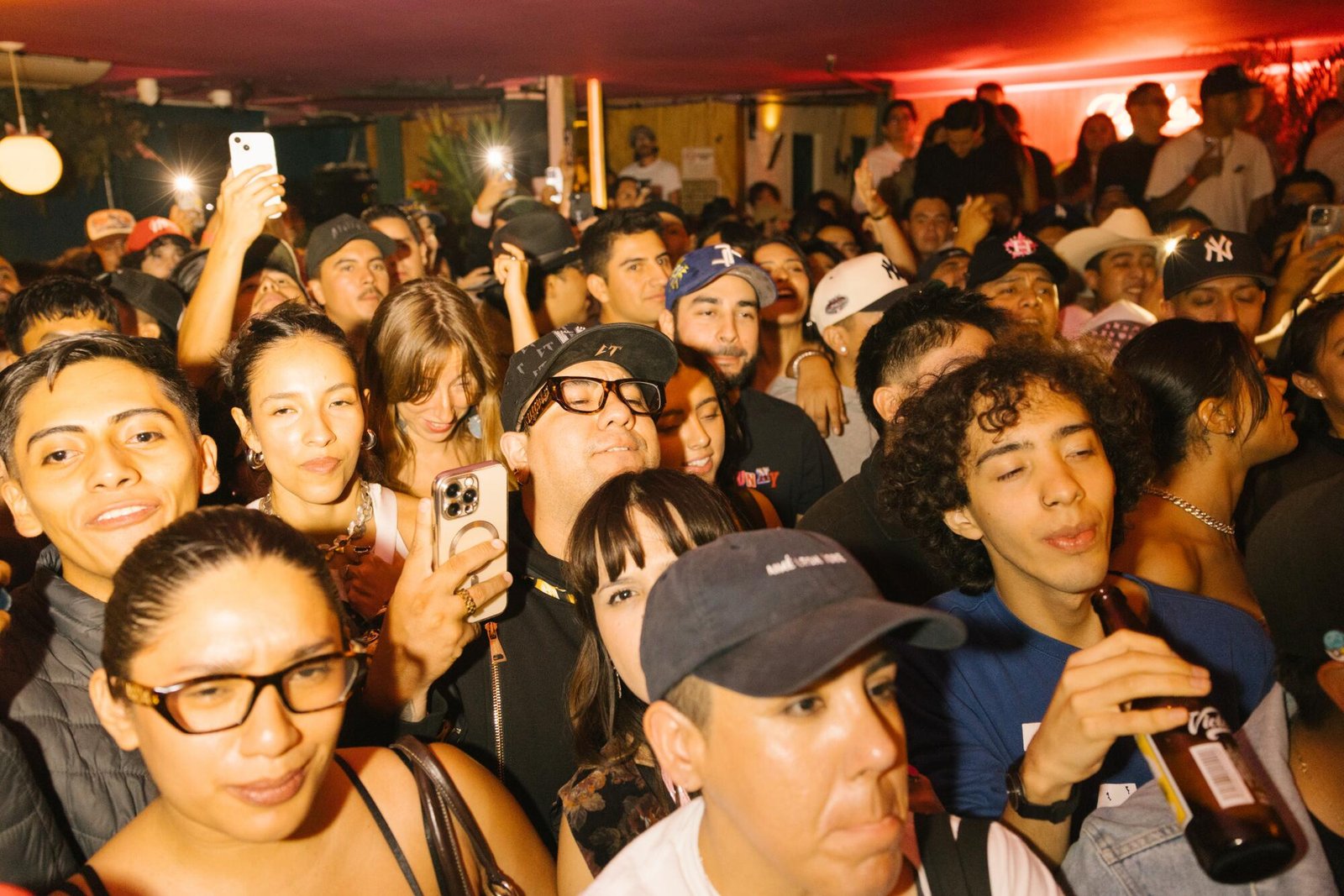 Audience members watch musicians play at Los Guitarrazos