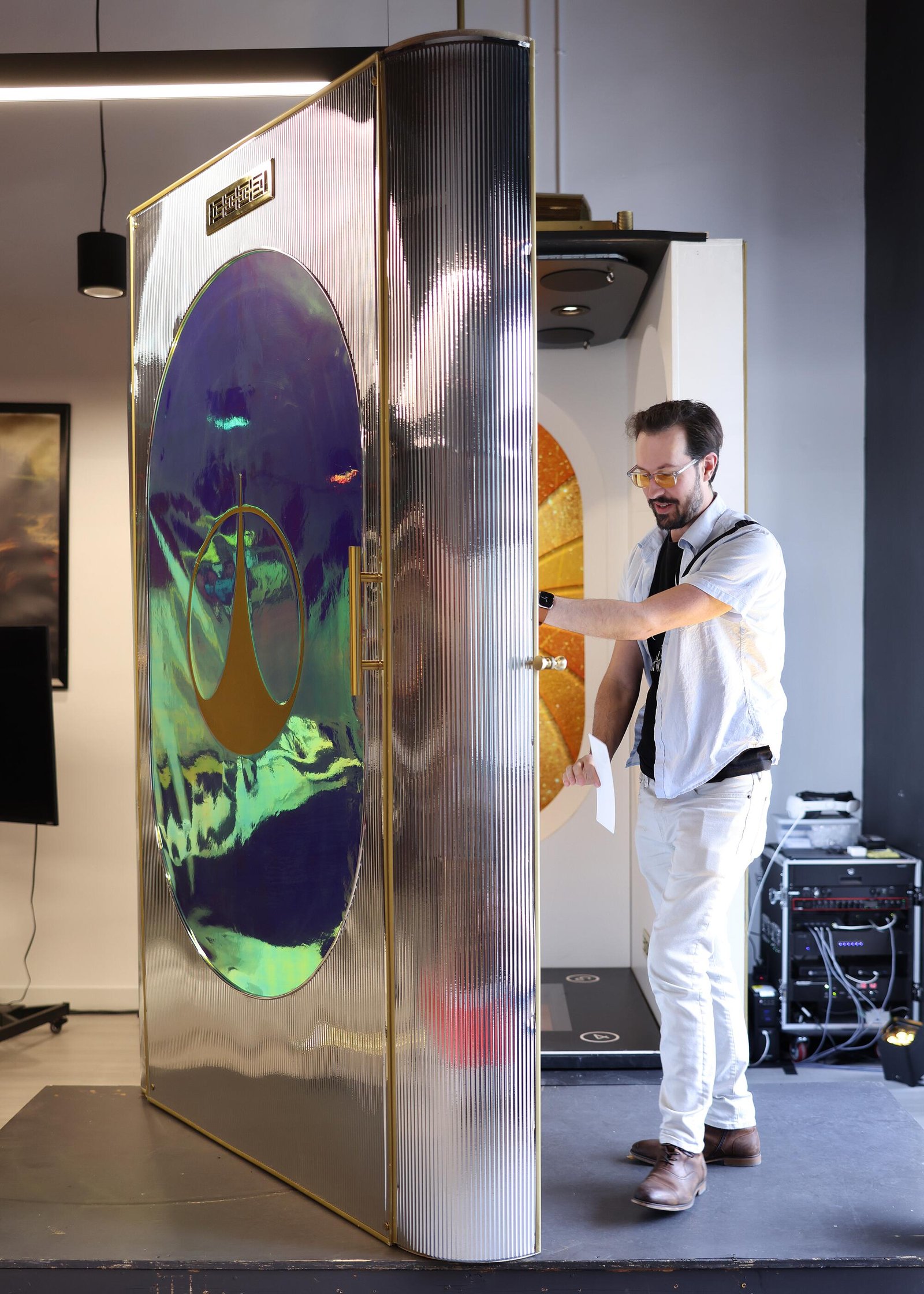 Chris Clavio shows his space elevator experience ride at Two Bit Circus arcade at Third Street Promenade.