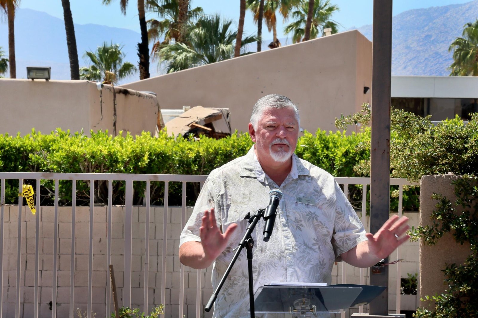 Palm Springs mayor Ron deHarte speaks during an outdoor news conference. 
