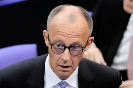 Friedrich Merz reacts after he was not elected new Chancellor in the first voting process at the parliament Bundestag in Berlin.