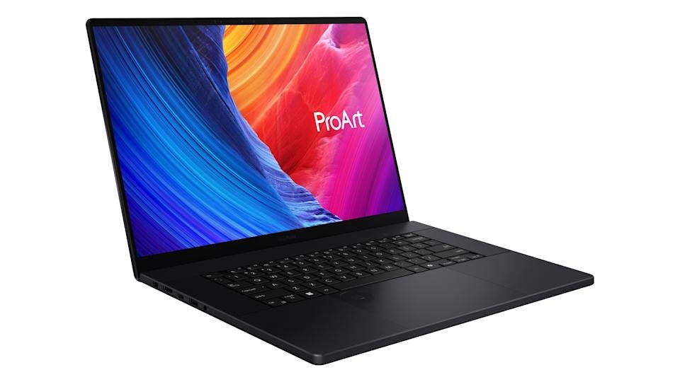 A black 16-inch Asus laptop with a giant trackpad.