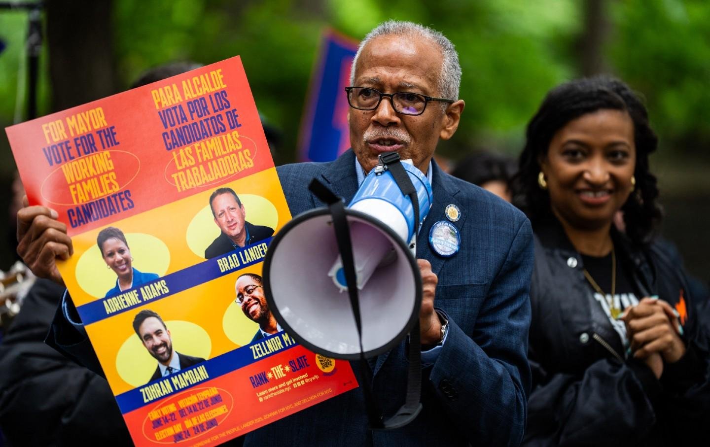 State Senator Robert Jackson holds a campaign flyer supporting Working Families Party mayoral candidates during a rally in Brooklyn, New York.