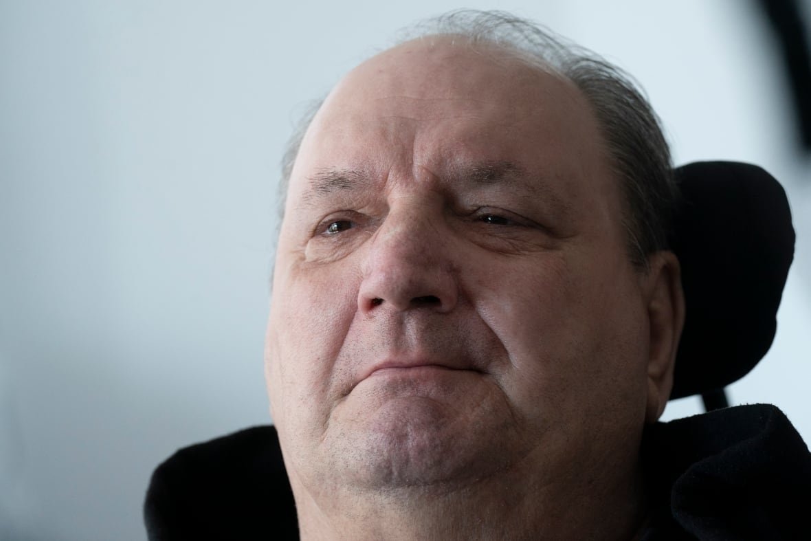 A close up photo of a man's face