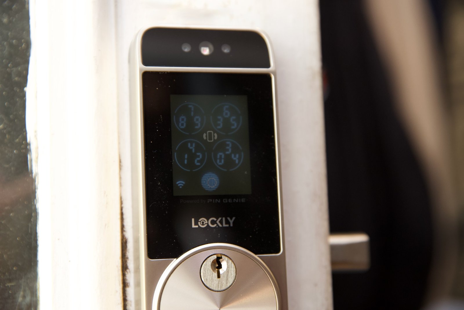 The keypad is small and can be hard to see. This is also the area you tap for Home Key. The facial recognition sensors are at the top of the lock; there’s a keyway and a fingerprint reader below that.
