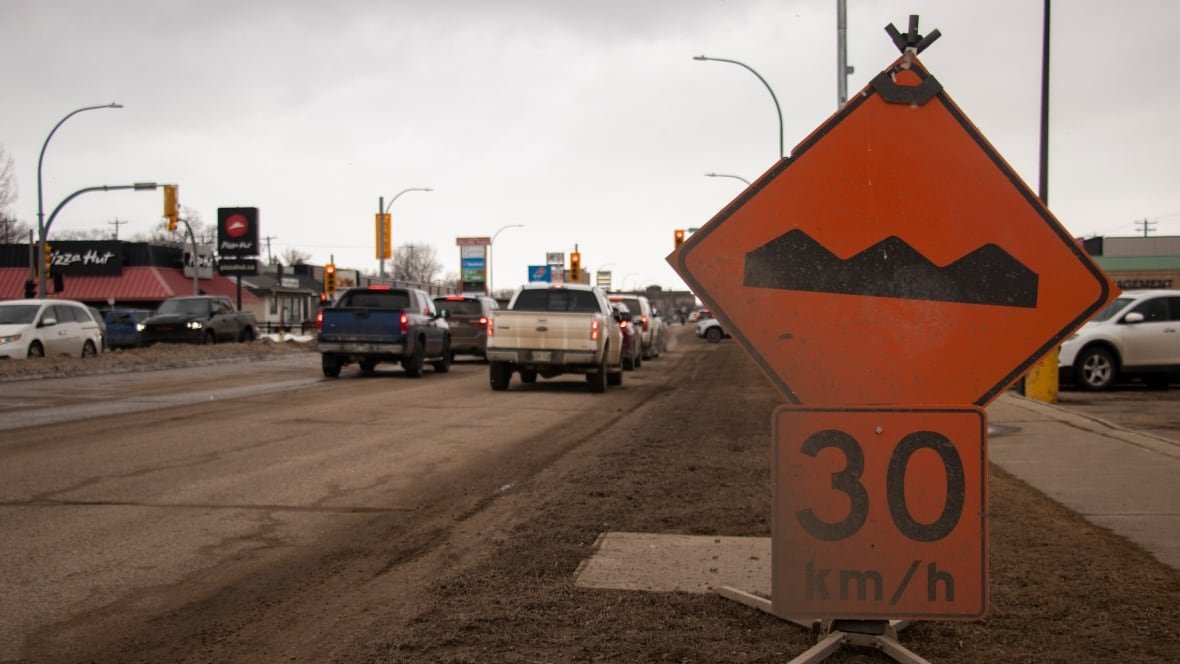 A signs warns motorists to slow down to 30 kilometres an hour.