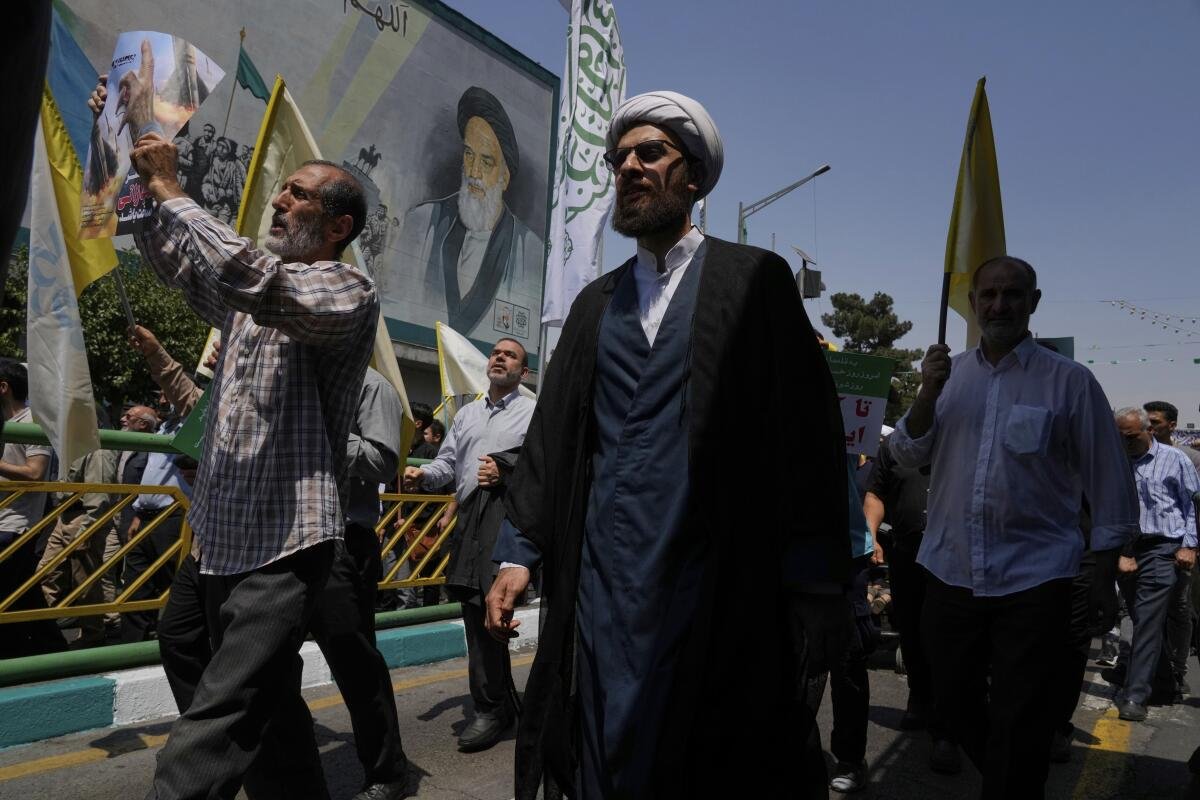 People walk down a street