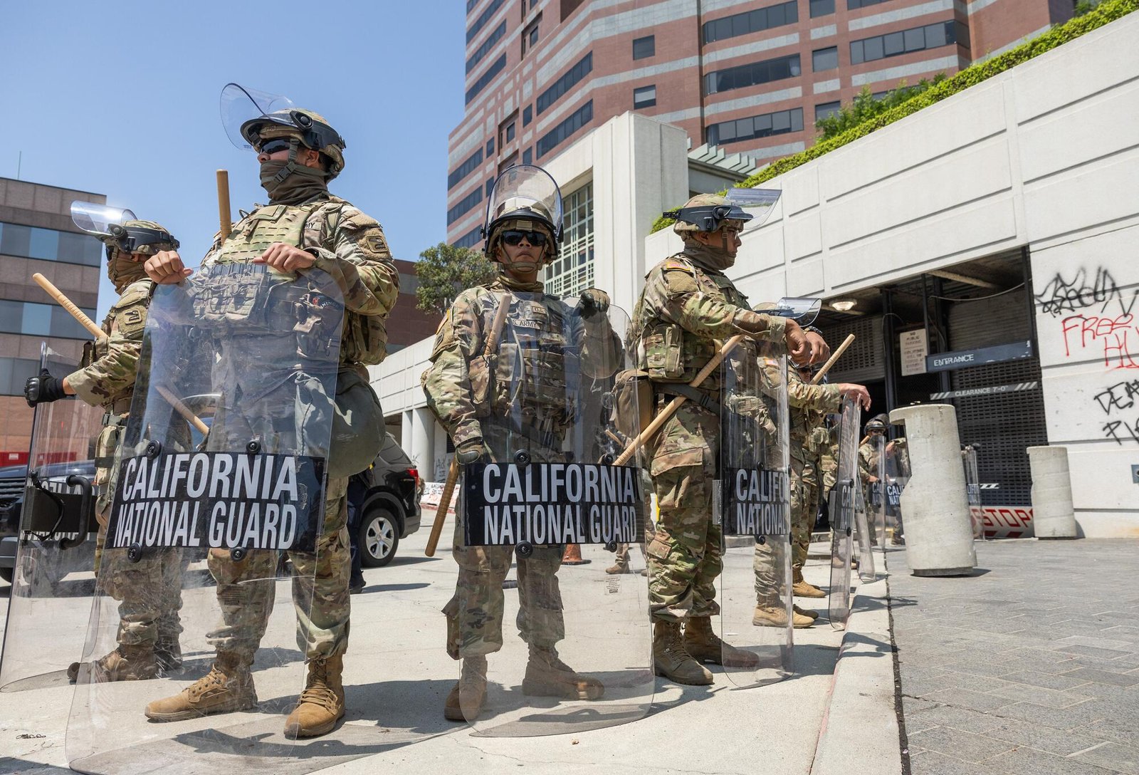 National Guard members stand at post at the Edward R. Roybal Federal Building.