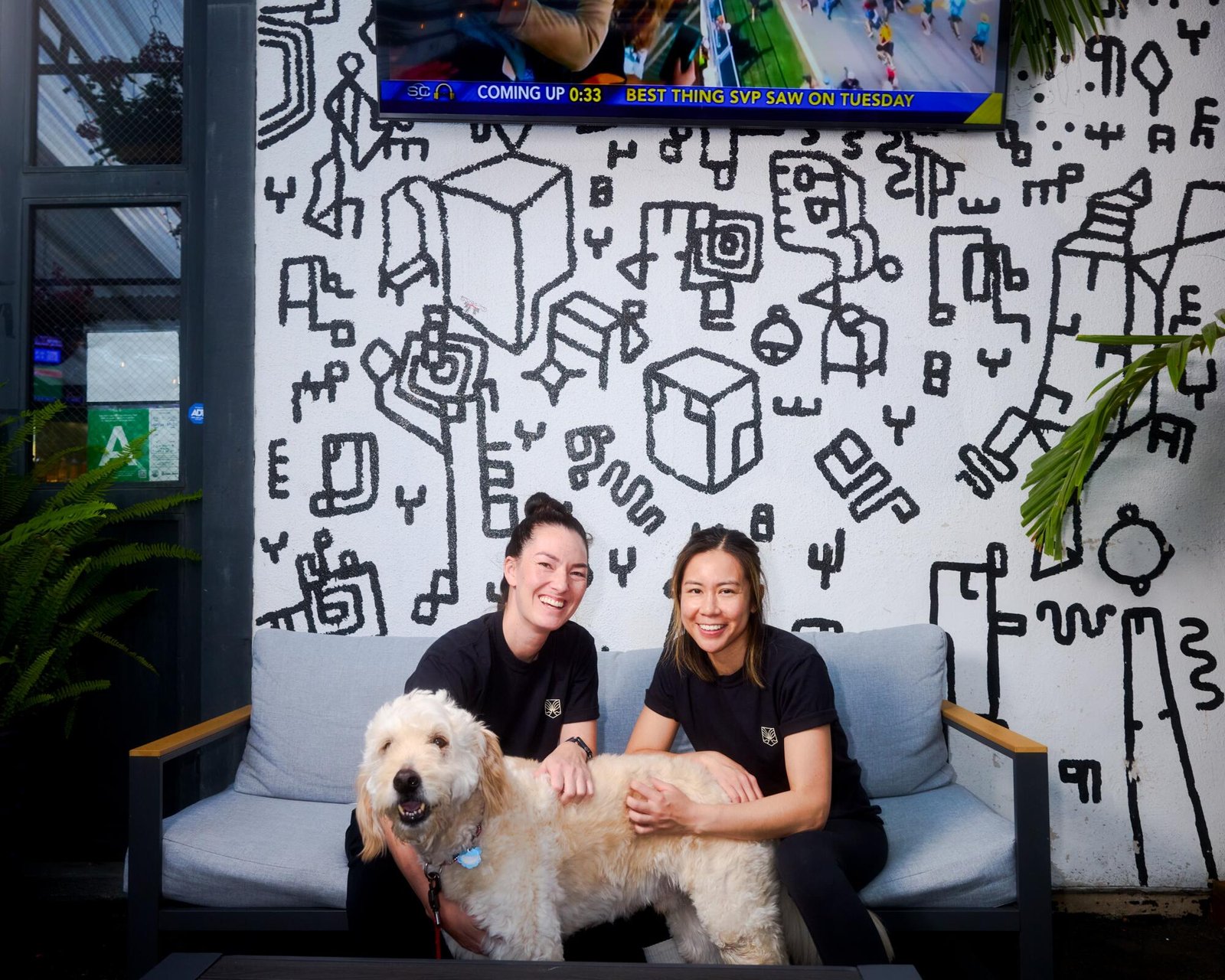 Stephanie, left, and Janie Ellingwood with a dog