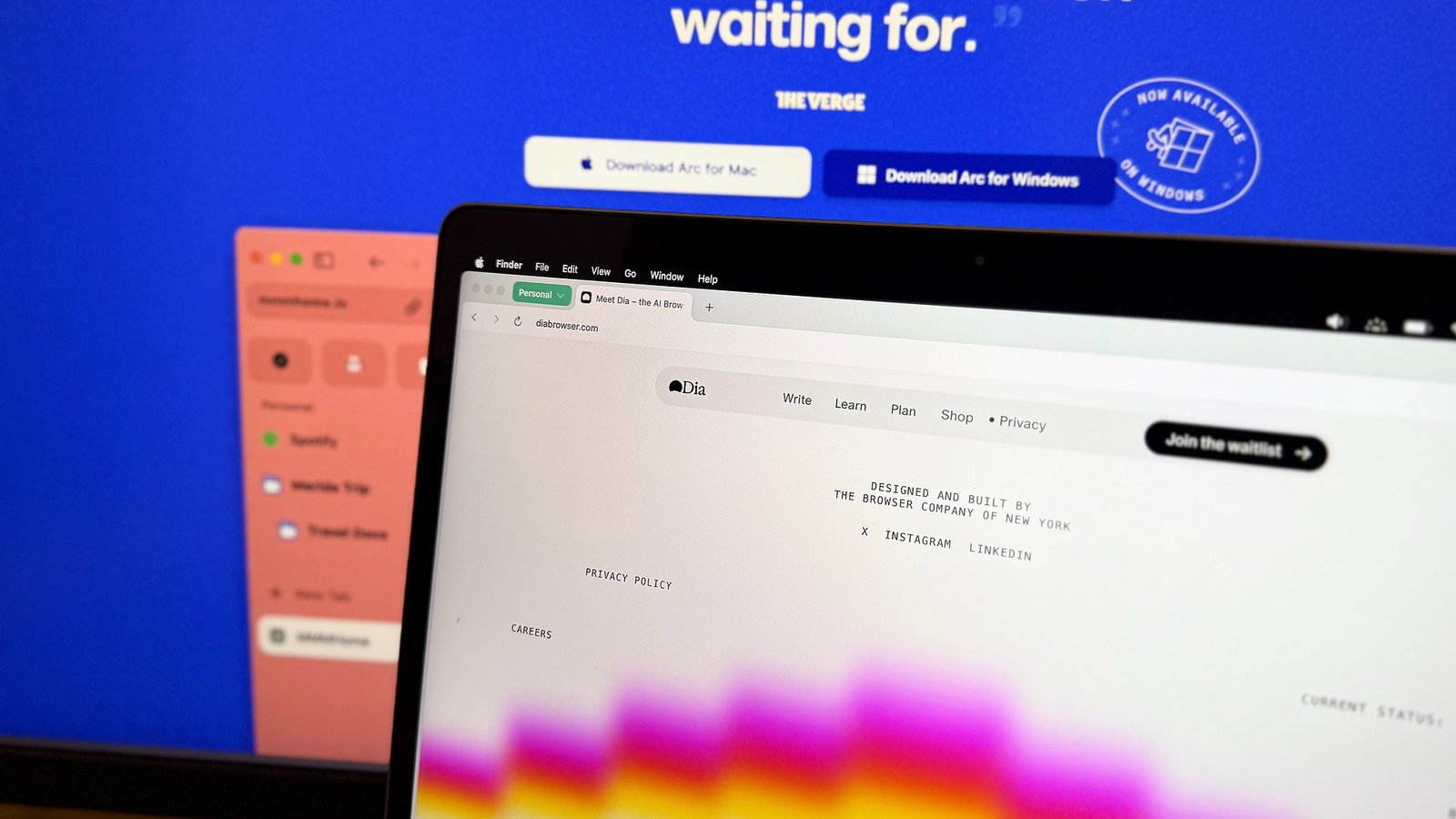 Dia browser website open on a Macbook Air against a blue background