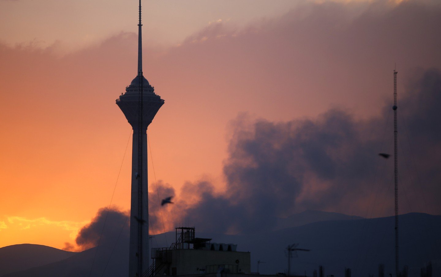 Smoke rises from the area where Israeli forces struck the Iranian state television building in Tehran, Iran, on June 16, 2025. The Iranian Radio and Television Broadcasting Corporation reported in a statement that its building in the capital Tehran was targeted by Israel.