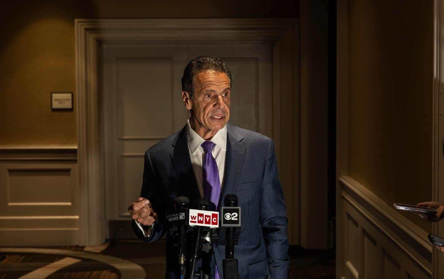 Disgraced former New York governor Andrew Cuomo addresses the media following a speech on June 22, 2025, in New York City.
