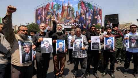 People chant slogans during a protest against Israel’s wave of strikes on Iran