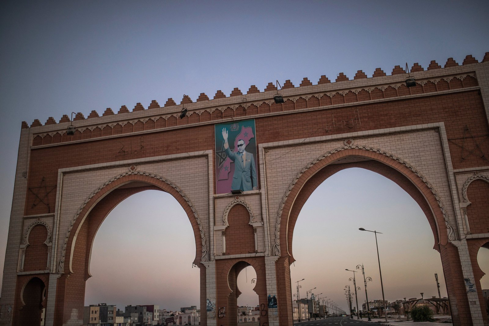 Archway to Western Sahara with image of the Moroccan king - the territory has been subject of a long-running dispute between Morocco and the Popular Front for the Liberation of Saguia el-Hamra and Río de Oro (Polisario Front)