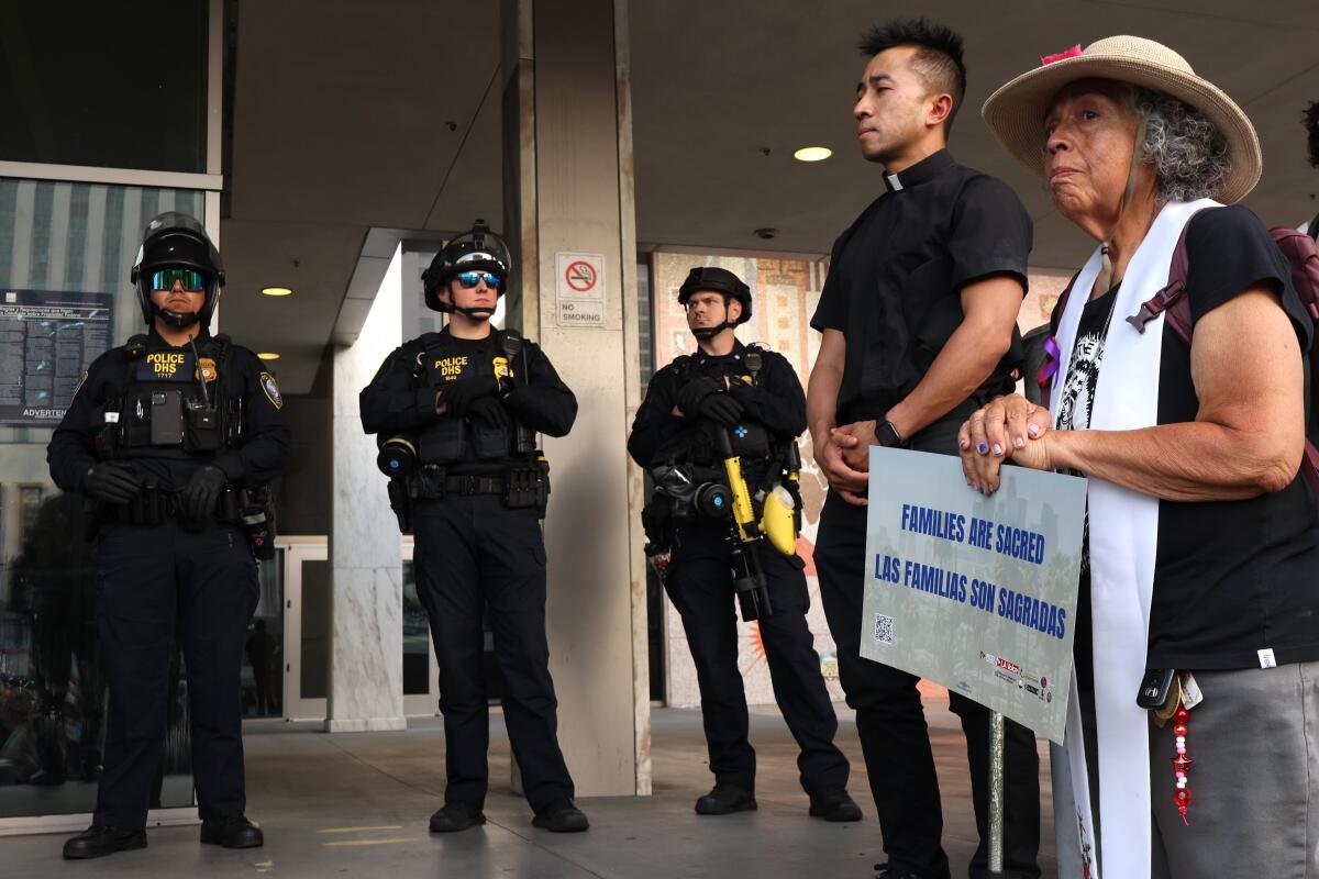 Police officers and protestors standing near each other