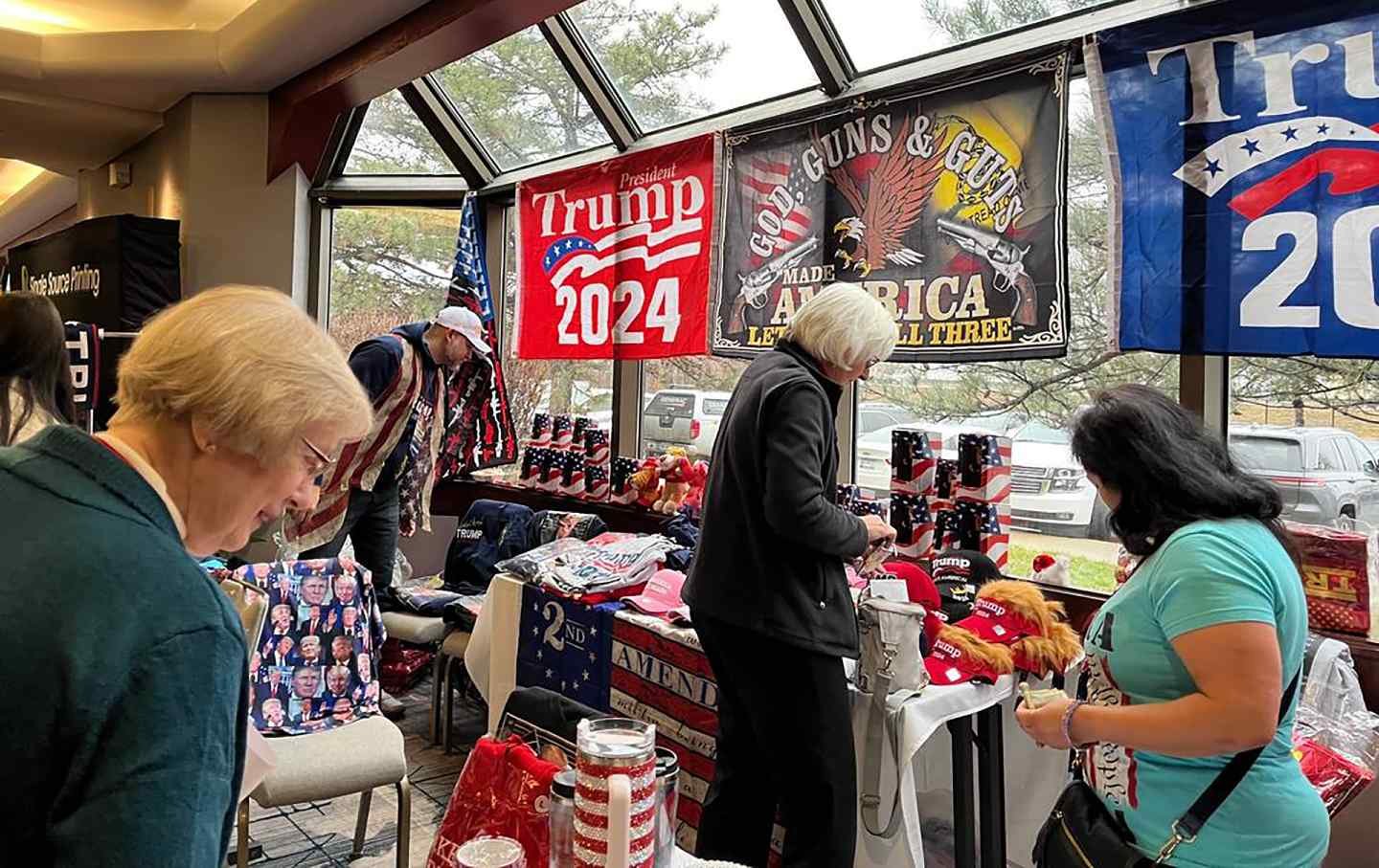 Shoppers browse the Trump Store at the Kansas GOP Convention in Overland Park.