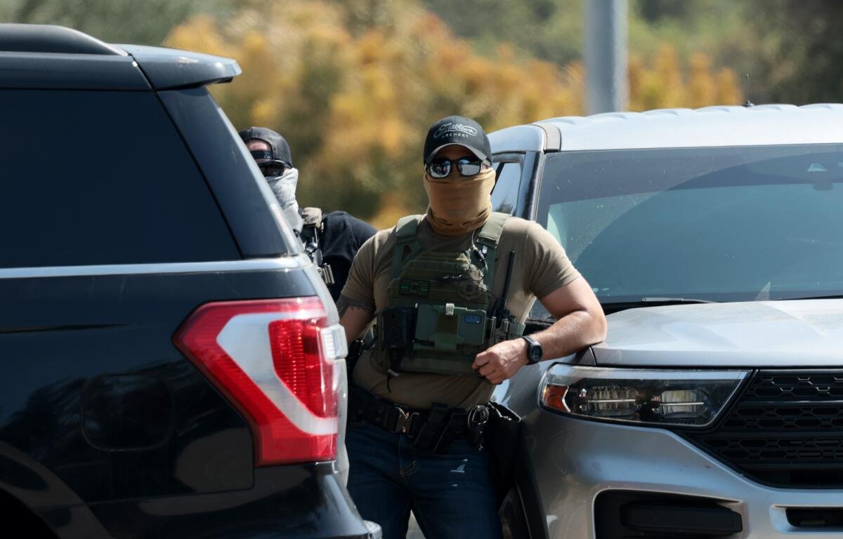 Federal agents stage outside Gate E of Dodger Stadium