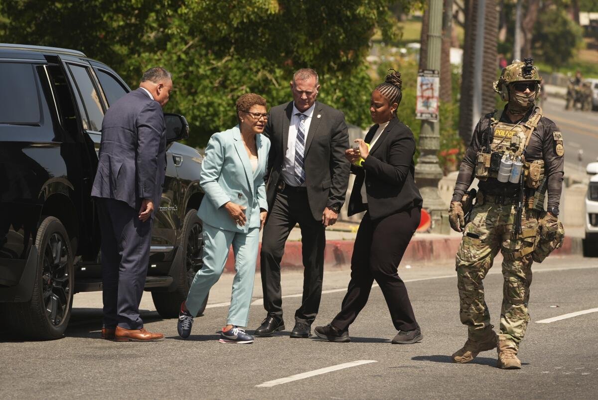 L.A. Mayor Karen Bass arrives at MacArthur Park on July 7 as federal agents staged there.
