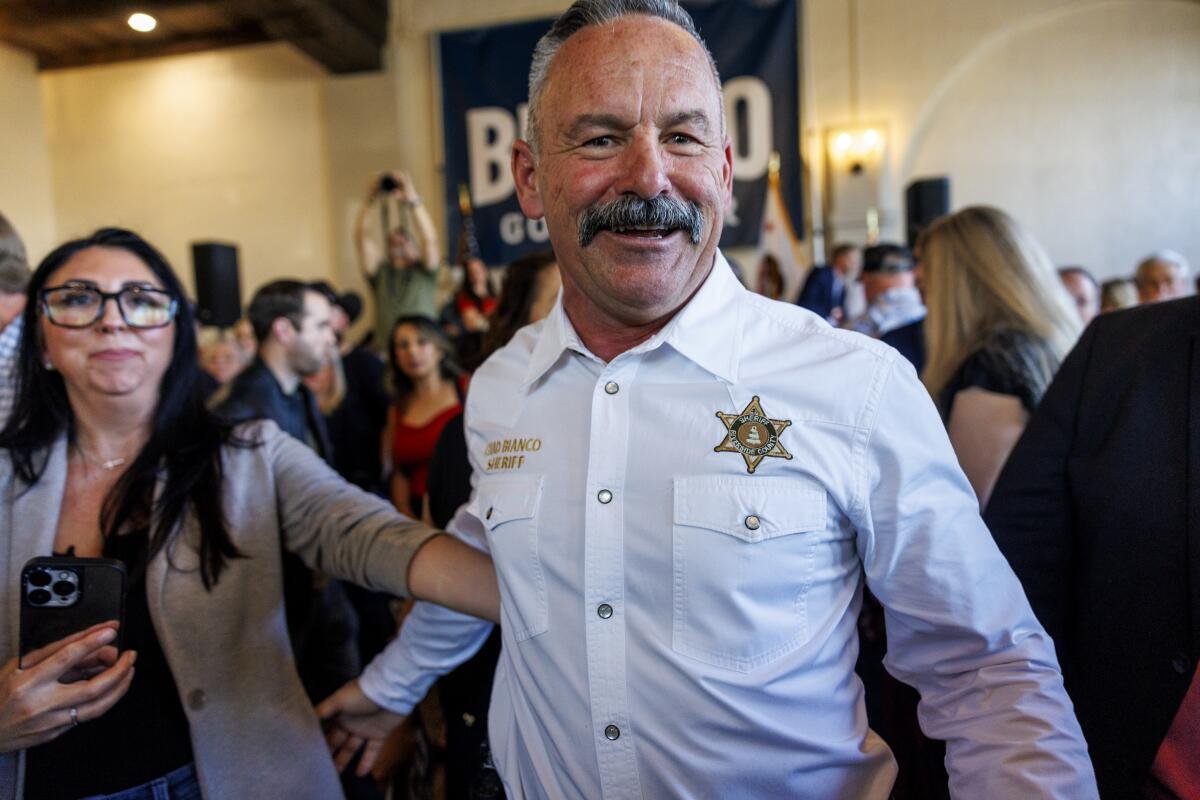 Riverside County Sheriff Chad Bianco shown with supporters as he announces his bid for governor.