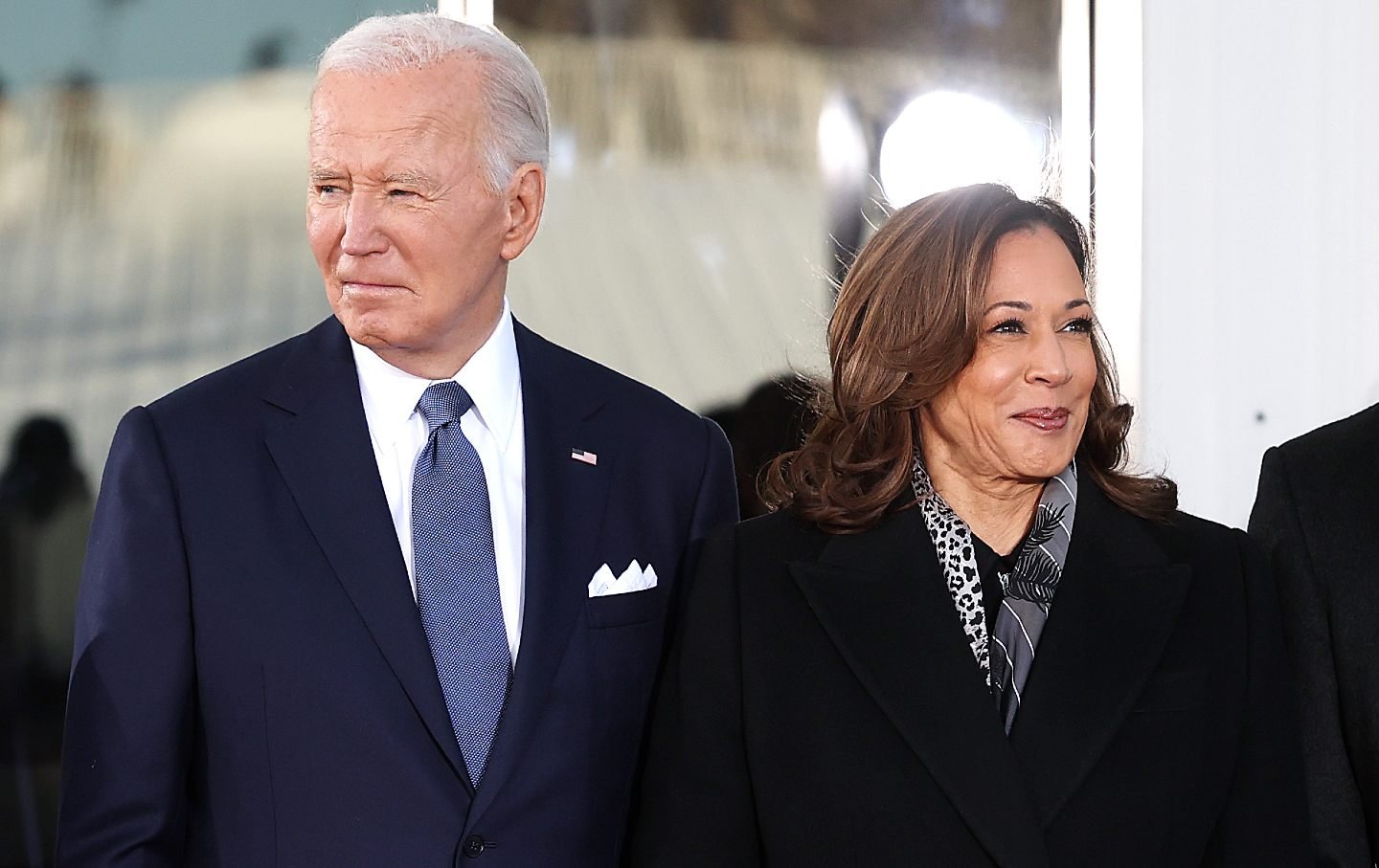 President Biden and Kamala Harris stand next to each other at the White House.