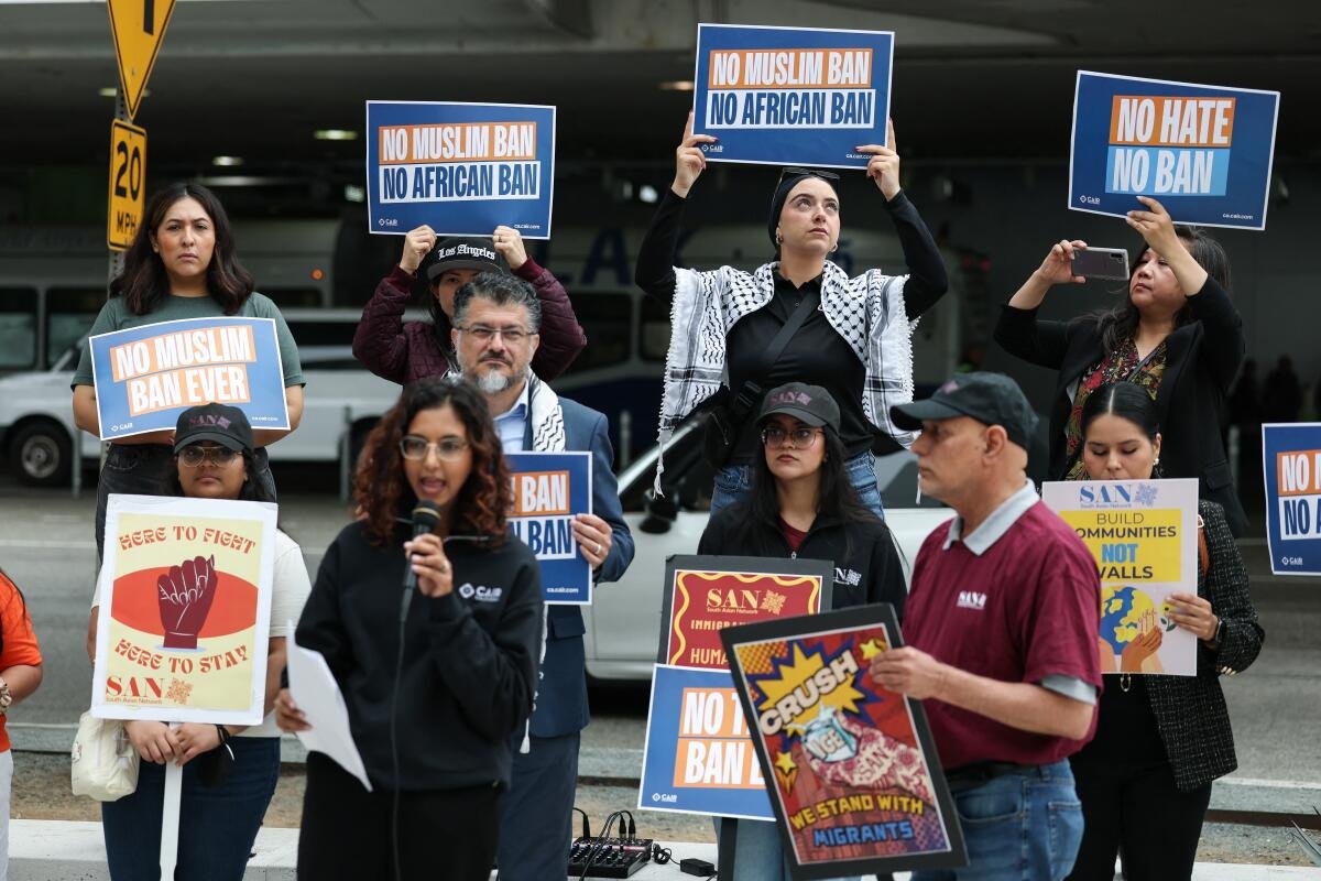 Demonstrators gather to protest against sweeping new travel ban