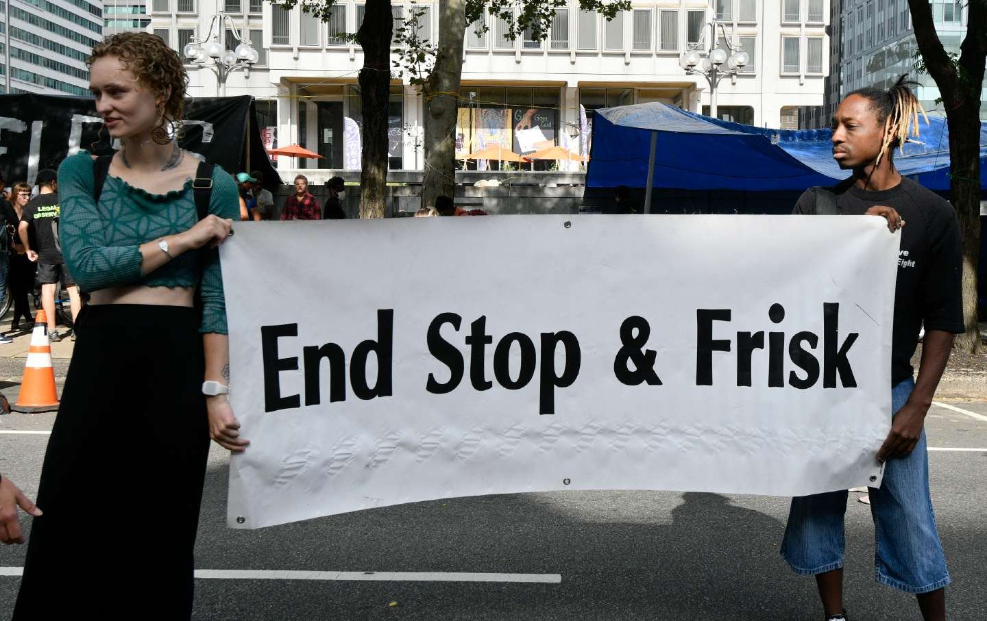 People hold up a sign during a protest in Philadelphia.
