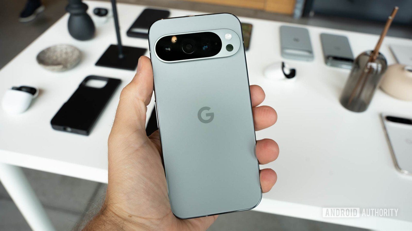 Google Pixel 9 Pro in Hazel color held in person's left hand with back facing viewer Google Pixel 9 Pro in Hazel color held in person's left hand with back facing viewer
