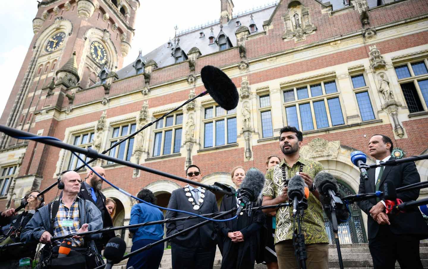 The director of the Pacific Islands Students Fighting Climate Change, Vishal Prasad (2nd R), speaks to the media in The Hague on July 23, 2025. The world’s highest court on July 23 declared that states have a legal obligation to tackle climate change and that failing to do so was a “wrongful act” that could open the door to reparations.