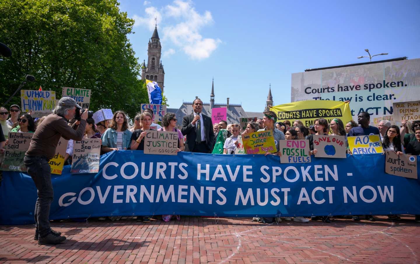 Vanuatu's Climate Change Minister Ralph Regenvanu, center, delivers a speech ahead of the International Court of Justice (ICJ) session tasked with issuing the first advisory opinion on states’ legal obligations to address climate change in The Hague on July 23, 2025.