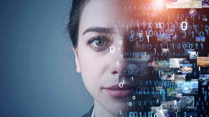 A face disappearing into digital imagery