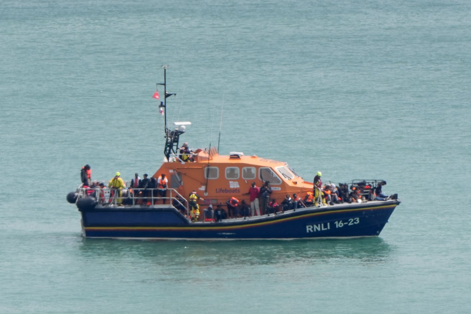 A group of people thought to be migrants are brought in to the Border Force compound in Dover, Kent, from an RNLI Lifeboat following a small boat incident in the Channel (Gareth Fuller/PA)
