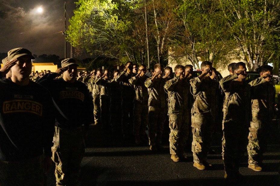 Picture of the most elite soldiers salute before dawn before the start of the Best Ranger Competition at Fort Benning in Columbus, Georgia April 11, 2025. 