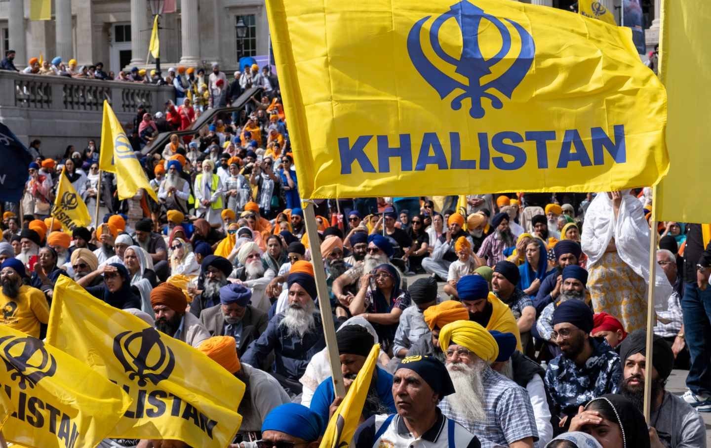 Sikhs gather in London's Trafalgar Square on the 41st anniversary of the attack by Indian government forces on the Golden Temple in Amritsar. Many in attendance carried yellow Khalistan flags.