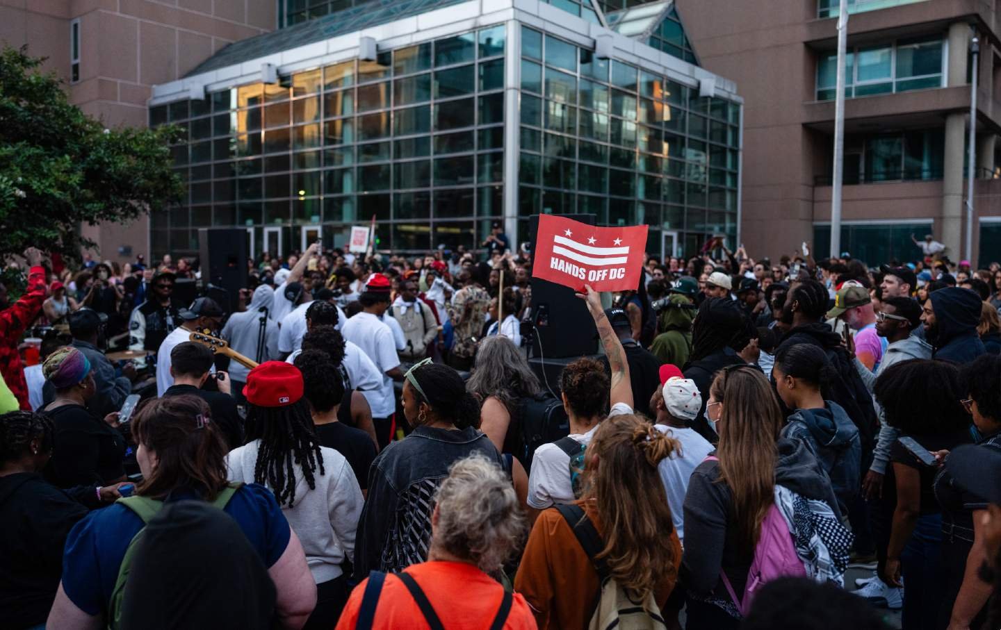 Demonstrators listen to a go-go band during a “Free DC” protest in Washington, DC, on August 21, 2025.
