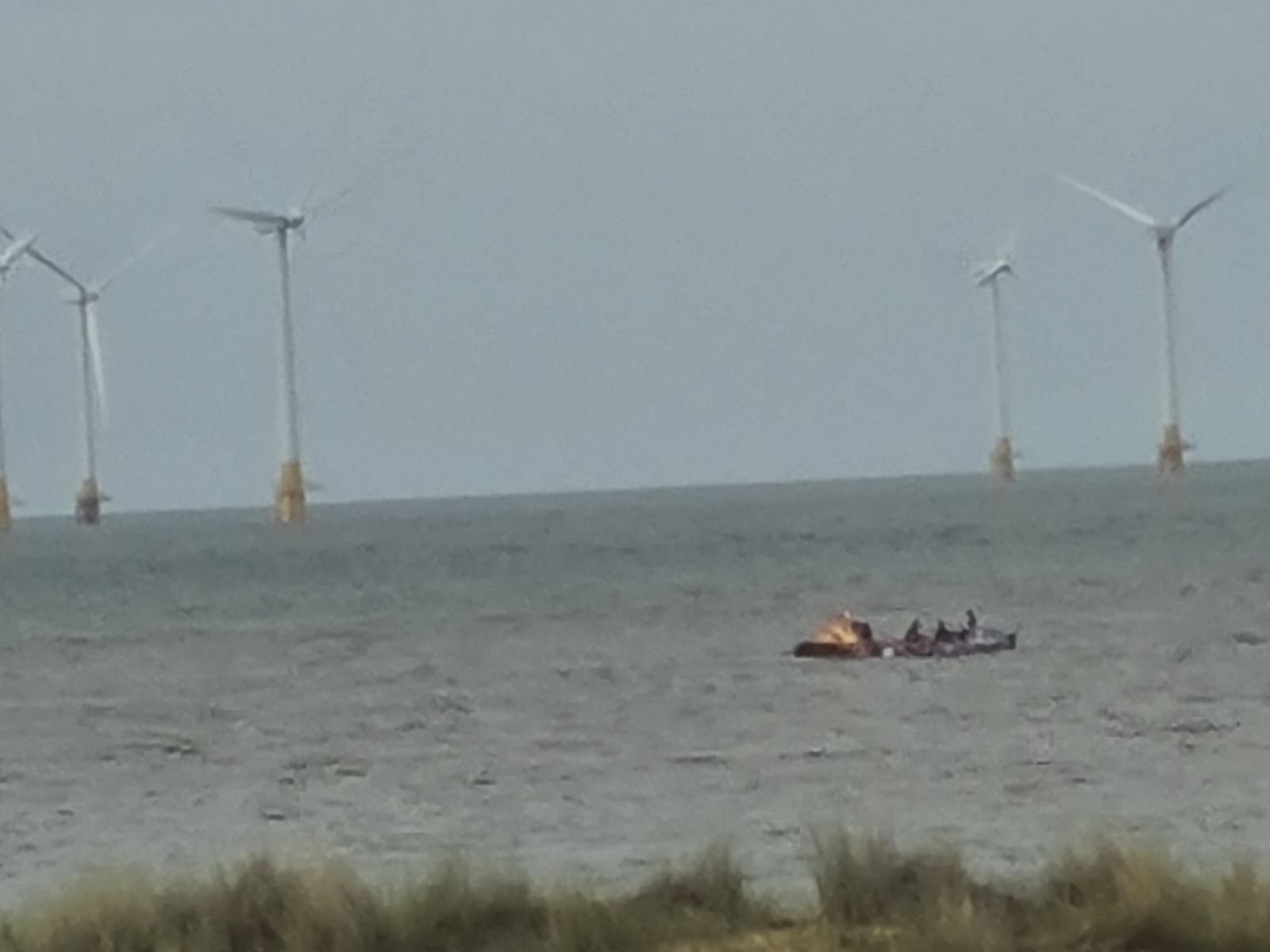 The MP had posted a picture on social media on Thursday night showing a boat near wind turbines off the Norfolk coast