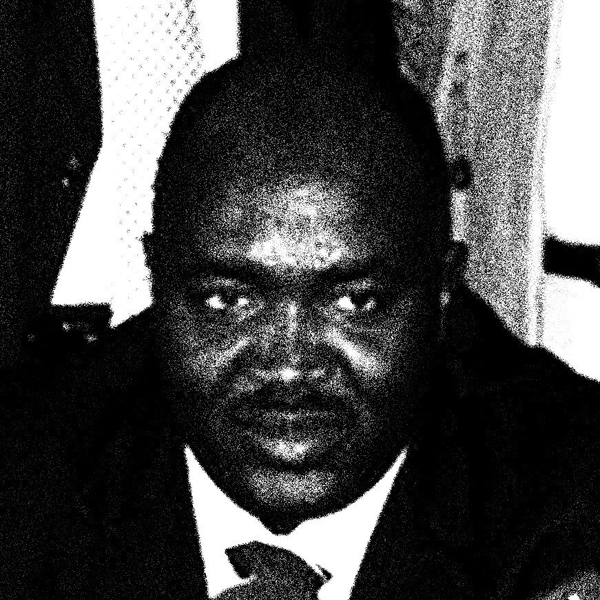 black-and-white photo of man in suit and tie