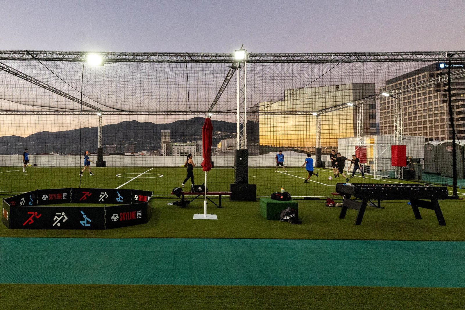 People enjoy an evening playing soccer.