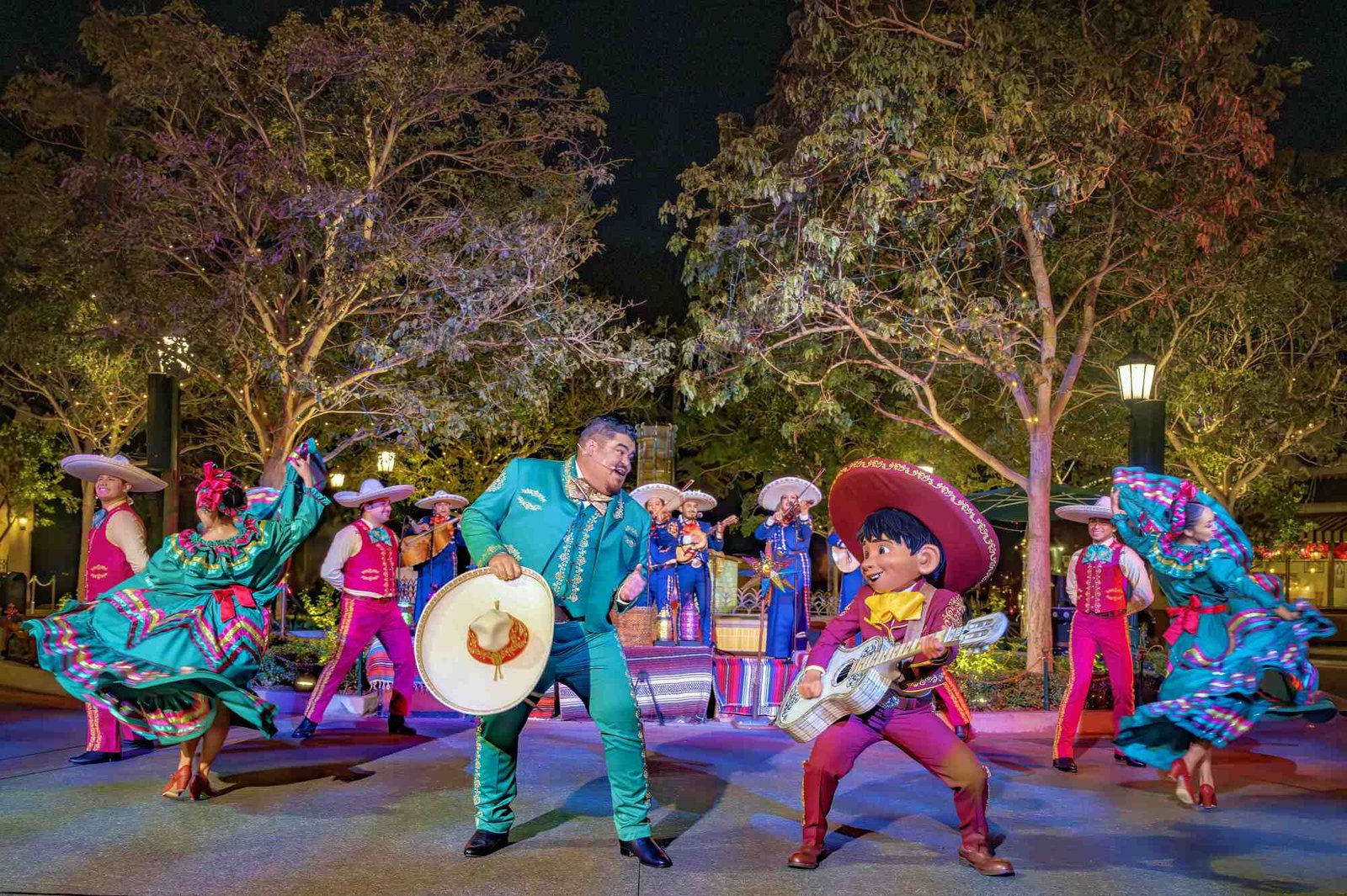 A mariachi band performs with an actor in a Miguel ("Coco") costume. 