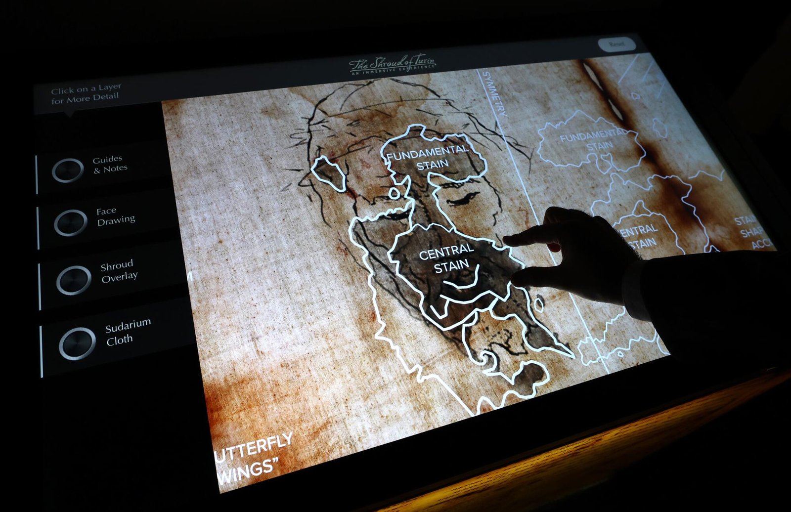 Patrons use an interactive screen. 