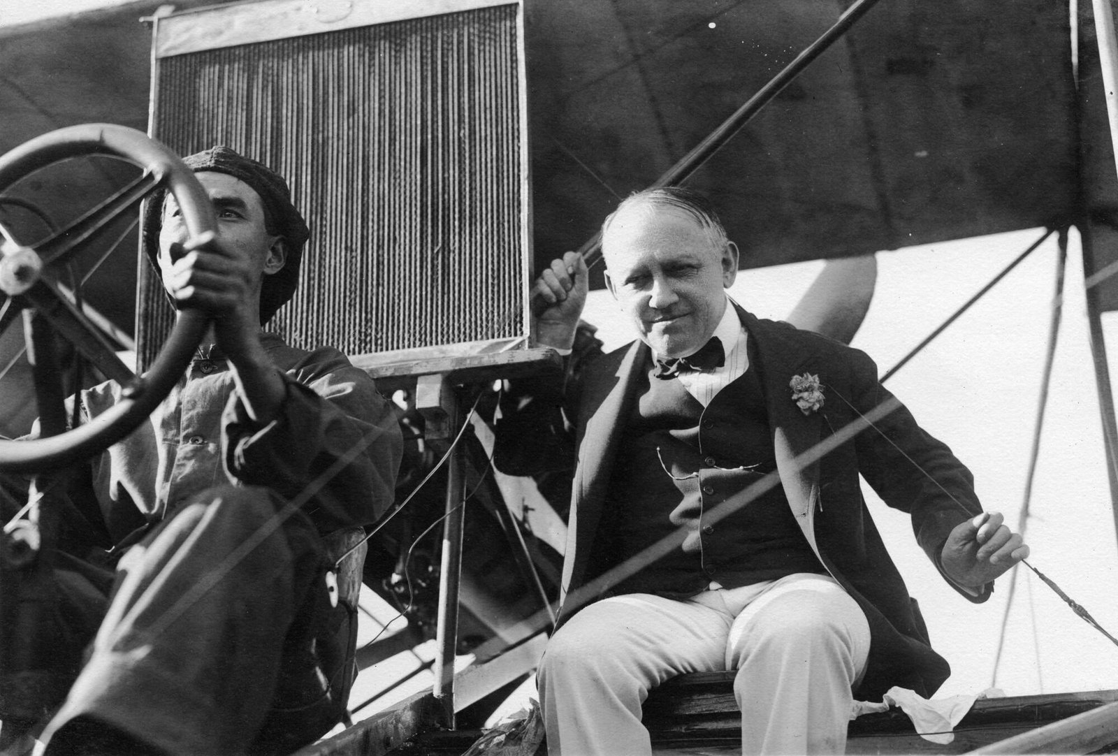 Carl Laemmle on the wing of an airplane with aviator Frank Stites.