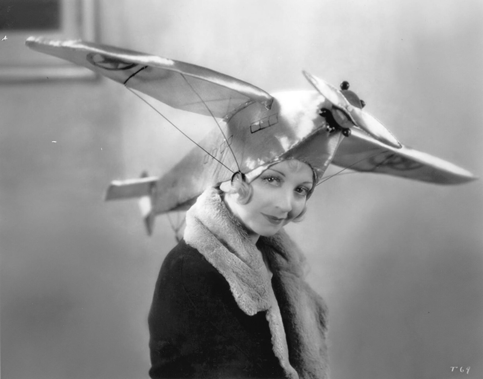 Alice White wears an airplane hat in 1930.